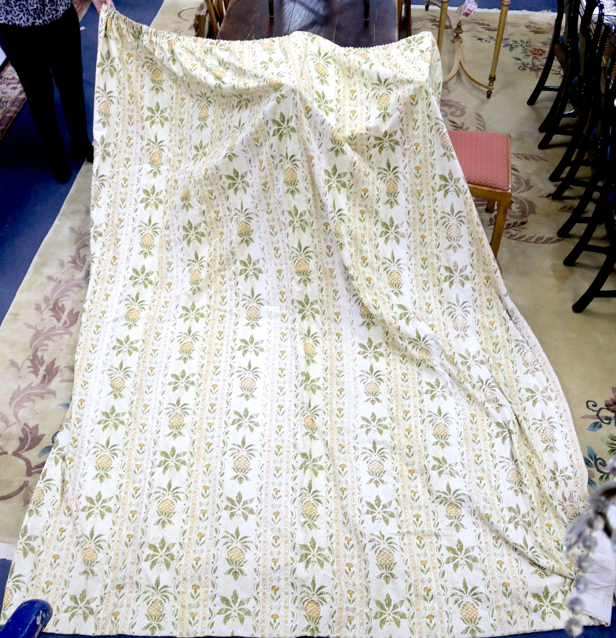 A pair of linen, 'Morris' style curtains and another pair of cotton curtains with a pineapple design